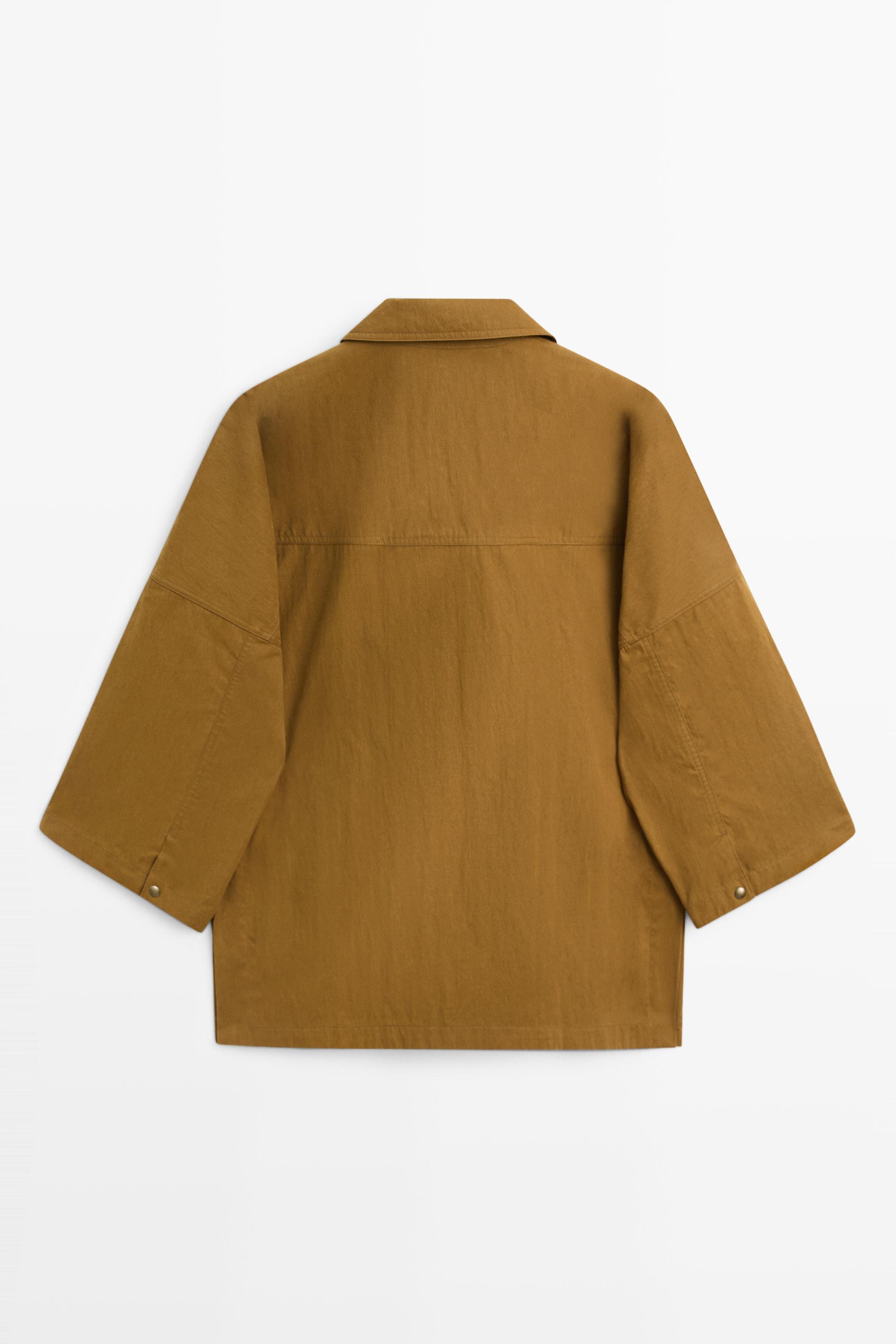 Button-tab cape jacket